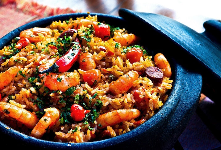 Types of pans: a blue enamel dutch oven full of paella