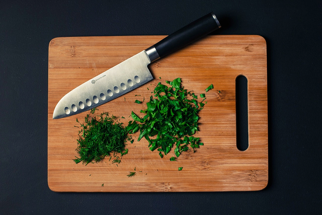 Best wood for cutting board: minced herbs on a cutting board