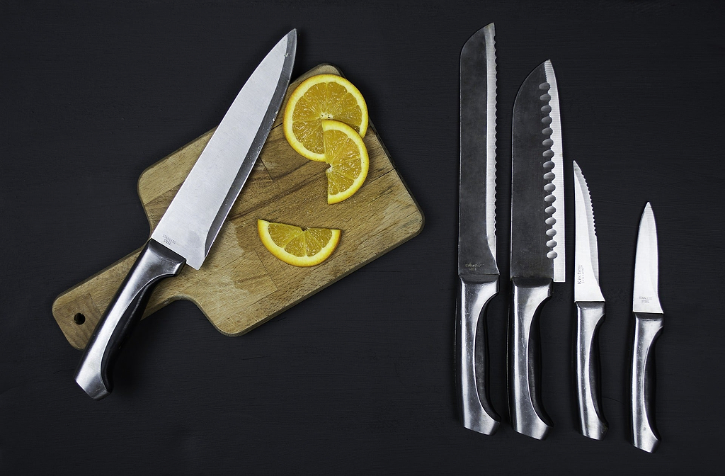 Kitchen knives: a set of kitchen knives and a cutting board