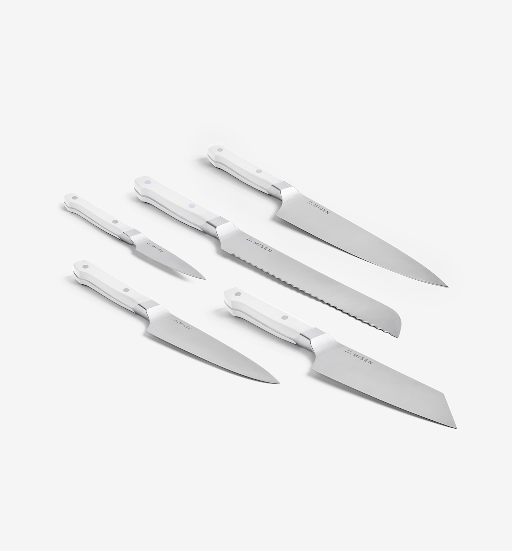 Misen 5-piece kitchen knife set with white handles including chef, bread, santoku, utility, and paring knives