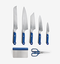 Misen 7-piece kitchen knife set with blue handles including bread, chef, santoku, utility, paring knives, shears, and bench scraper