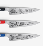 Misen kitchen knives with engraved mushroom, carrot, and fish illustrations on steel blades