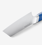 Misen kitchen knife blade close-up with blue handle and stainless steel finish