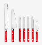Misen 7-piece knife set with red handles including bread knife, chef's knife, steak knives, and paring knife