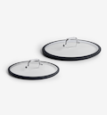 Glass cookware lids with silicone rim and stainless steel handle, set of two sizes