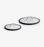 Glass pan lids with silicone rims and stainless steel handles, two sizes