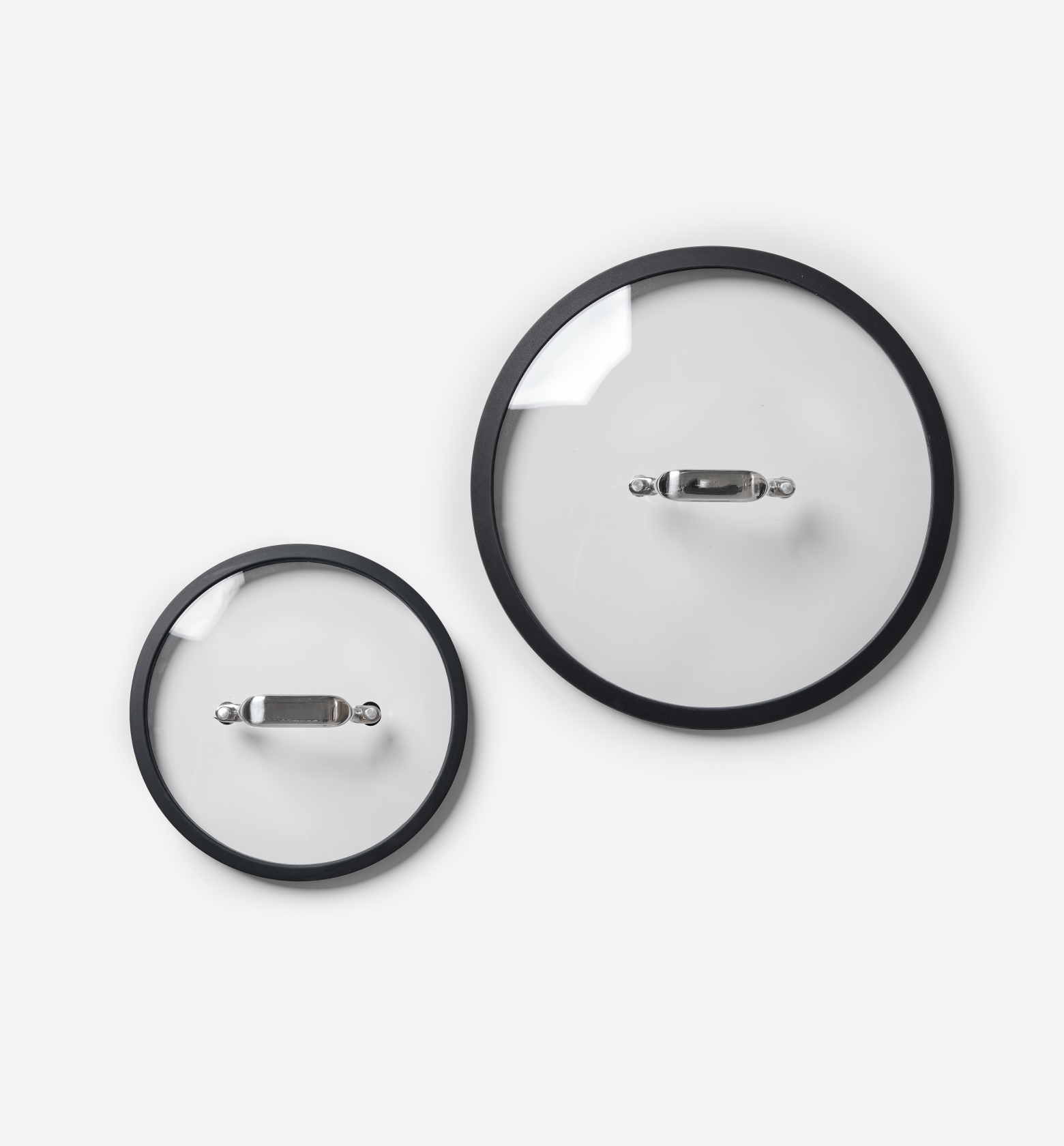 Glass pot lids with black silicone rim and stainless steel handle, two sizes