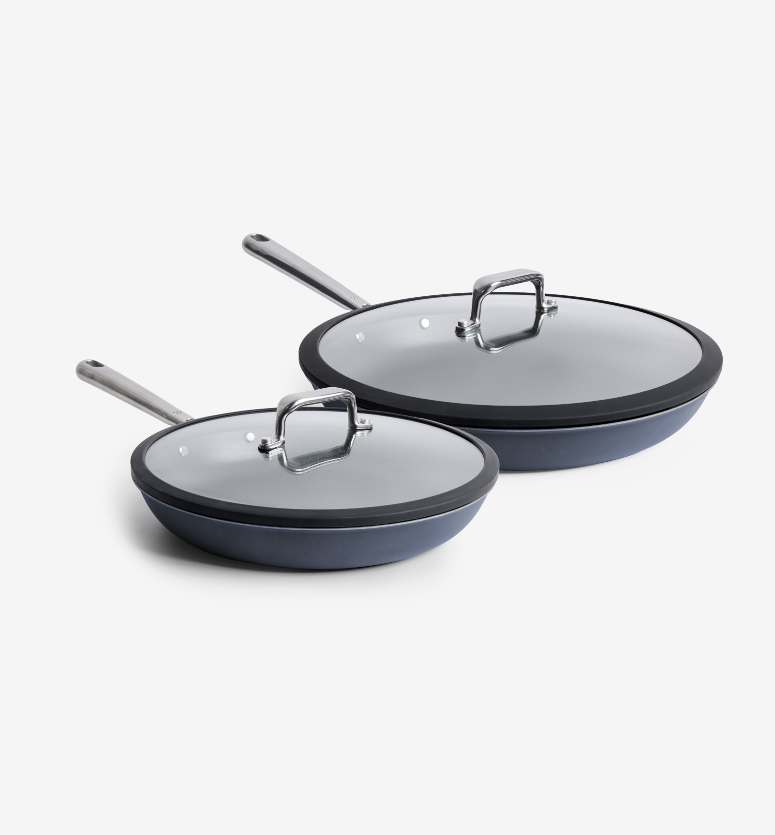 Dark gray nonstick frying pans set with glass lids and stainless steel handles, two sizes