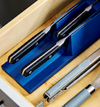 Miden in-drawer knife organizer holding three kitchen knives in blue foam block