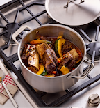 Braised beef short ribs with vegetables in Misen stainless steel pot on gas stove