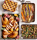 Thanksgiving feast spread with roasted turkey, rainbow carrots, Brussels sprouts, and cranberry lattice pie in Misen stainless steel pans