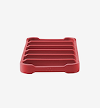 Red silicone trivet with raised ridges for heat protection
