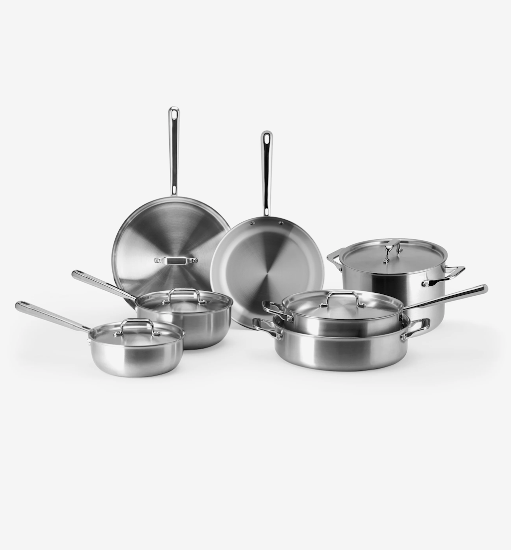 Stainless steel cookware set with pots, pans, and lids
