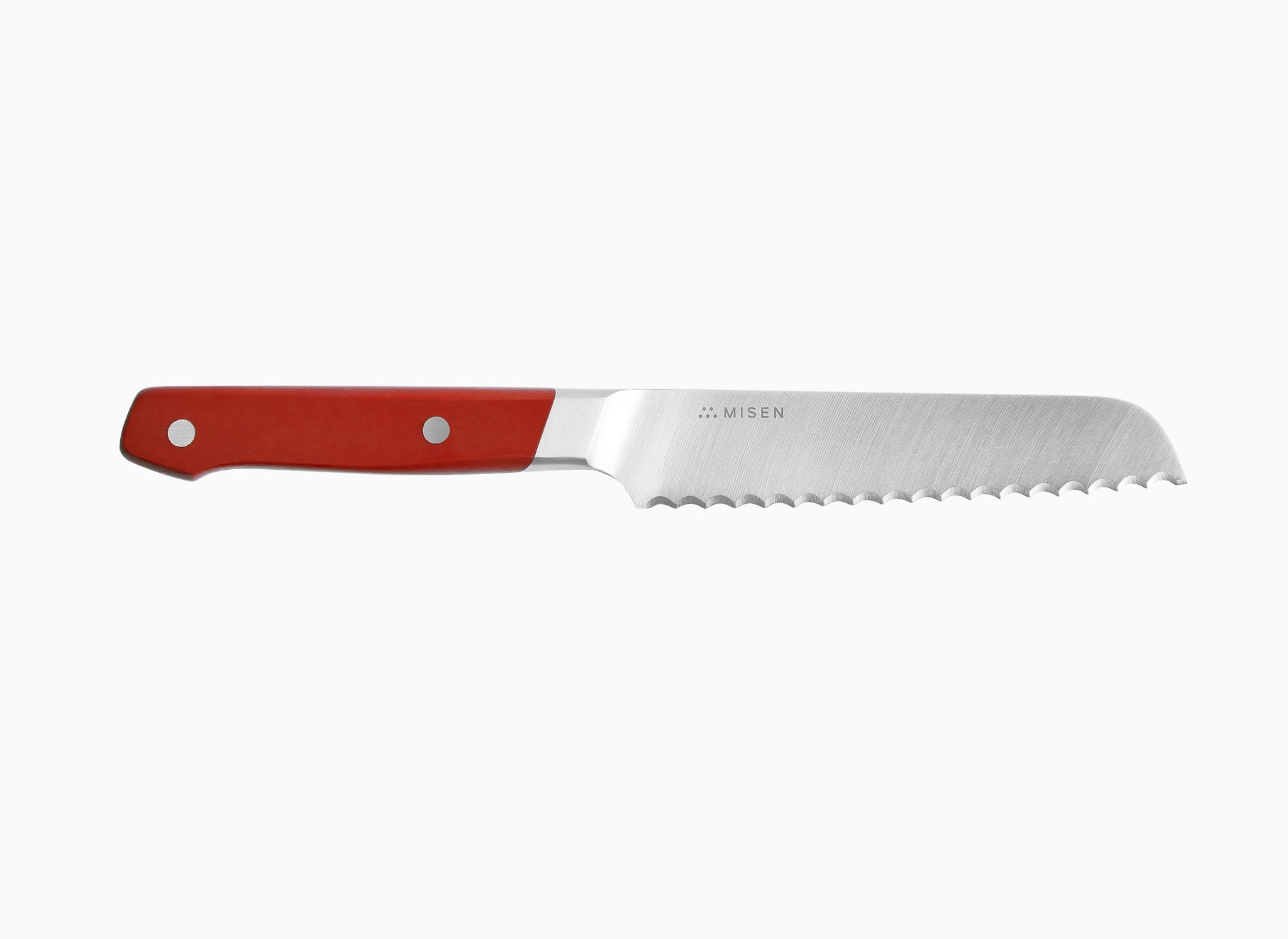 A side view of a red Misen Short Serrated Knife on a white background. 