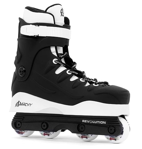 The Anarchy Revolution II Aggressive Inline Skates in black are perfect for tricks and grinds, featuring a high cuff for ankle support, white laces, black straps, "REVOLUTION" frame, and white wheels. Ideal for beginner to intermediate skaters.