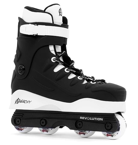 The Anarchy Revolution II Aggressive Inline Skates in black are perfect for tricks and grinds, featuring a high cuff for ankle support, white laces, black straps, "REVOLUTION" frame, and white wheels. Ideal for beginner to intermediate skaters.