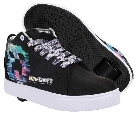 The Heelys x Minecraft Racer 20 Mid MMC Boys Shoes in black and white feature vibrant pixelated designs, patterned laces, a bold Creeper print, and signature built-in wheels for rolling fun.
