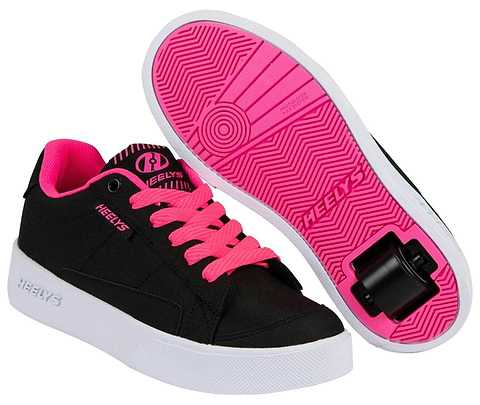 The Heelys Digilo Nylon Girls Shoes by Heelys feature a black and pink design; one shoe is upright showing the side, while the other is upside down displaying the low-profile wheels in the heel and patterned sole.