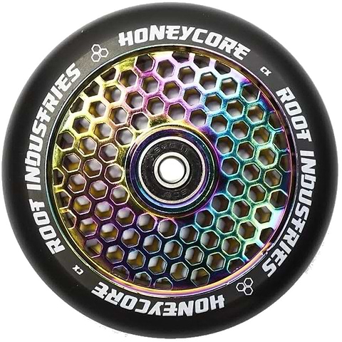 The Root Industries Honeycore 110mm Stunt Scooter Wheel in Black and Rocket Fuel Neochrome showcases a vibrant honeycomb design interior paired with a sleek black outer rim. It is equipped with premium Root Industries bearings, and the words "Root Industries" and "Honeycore" are elegantly inscribed on the rim.