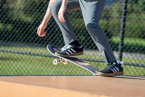 man on a skateboard about to go down a ramp