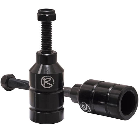 Two black Revolution Aluminium Stunt Scooter Pegs, designed from CNC milled aluminum, feature a cylindrical shape with a bolt on top for easy installation and the "R" logo on the side. Built to enhance your scooter's performance and durability, they offer precision engineering for stunts.
