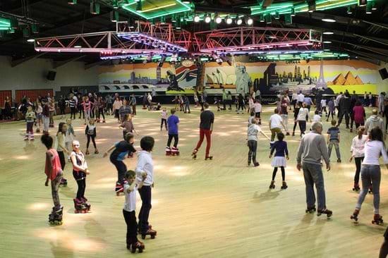 adults and children roller skating at rollerworld