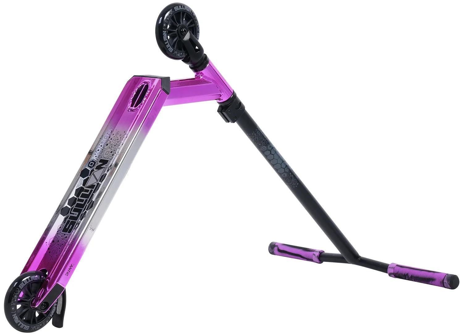 The Sullivan Antic Complete Stunt Scooter in pink, black, and silver is shown tilted to display its graphic deck, 110mm wheels, and handlebars with matching pink grips.