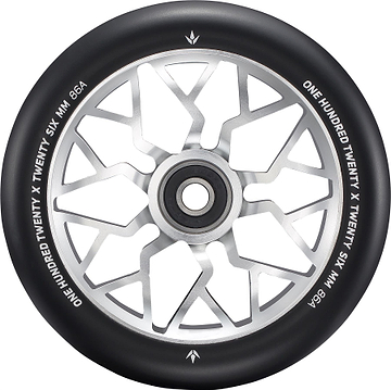 A close-up of the Blunt Envy Sector 120mm Stunt Scooter Wheel - Silver features a black and silver design with geometric spokes. The edge is marked with “ONE HUNDRED TWENTY X TWENTY SIX MM 86A.”.
