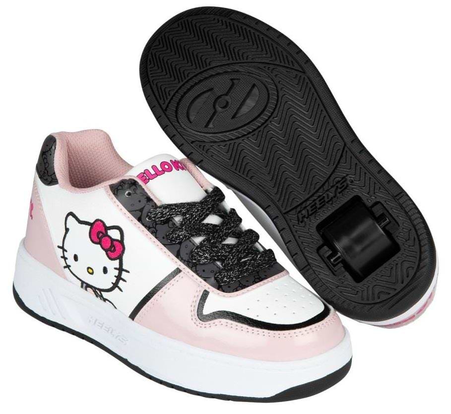 The Heelys x Hello Kitty Kama HKC Girls Shoes in light pink, black, and white feature the iconic cartoon cat face and include a single removable wheel in one shoe for skating fun.