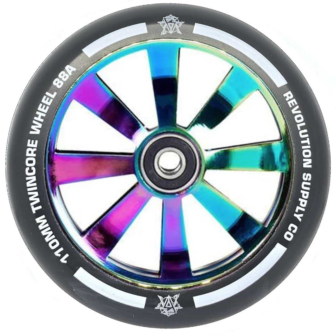 A close-up of the Revolution Twin Core 110mm Stunt Scooter Wheel - Neochrome by Revolution, featuring a reflective iridescent core, black tire with "110MM TWINCORE WHEEL 88A" and "REVOLUTION SUPPLY CO." text, plus ABEC 9 bearings for smooth rides.