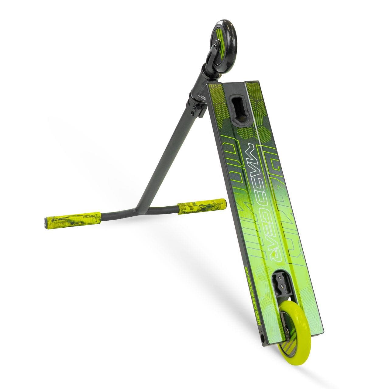 The Madd Gear MG 3 Zen Complete Stunt Scooter in Black/Lime is shown angled on its side. One wheel touches the ground, while neon lime wheels and handlebar grips stand out against bold green deck graphics. Brand: Madd Gear (MGP).