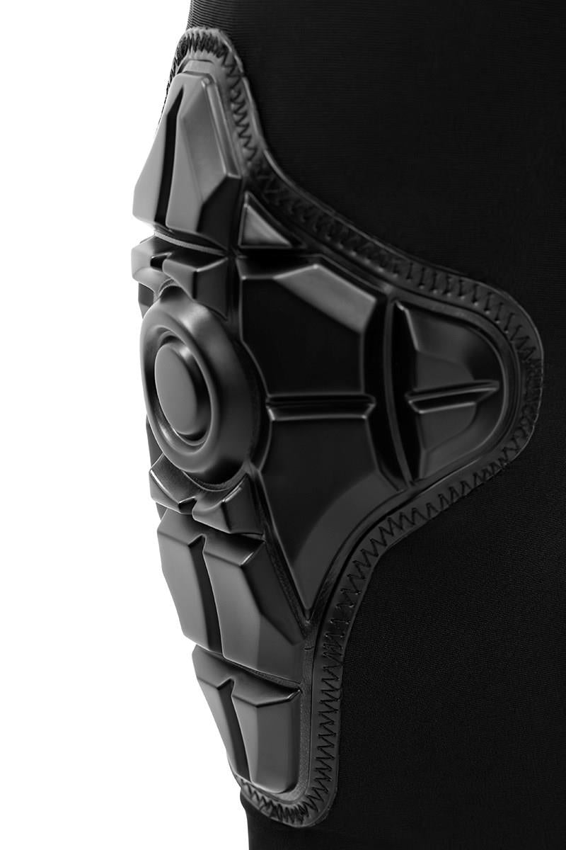 Close-up of the REKD Energy Knee Skate Protection Gaskets - Black, featuring geometric Energy Foam padding, detailed stitching, and impact protection on a durable black fabric sleeve by REKD.