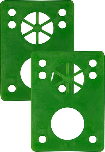 Two Essentials Skateboard Riser Pads in green, shaped as rectangular plastic plates with circular cutouts and holes, each showcasing an eight-spoke design in the top circle and a large round cutout at the bottom. These 1/8" riser pads by Essentials are placed side by side with a slight overlap.
