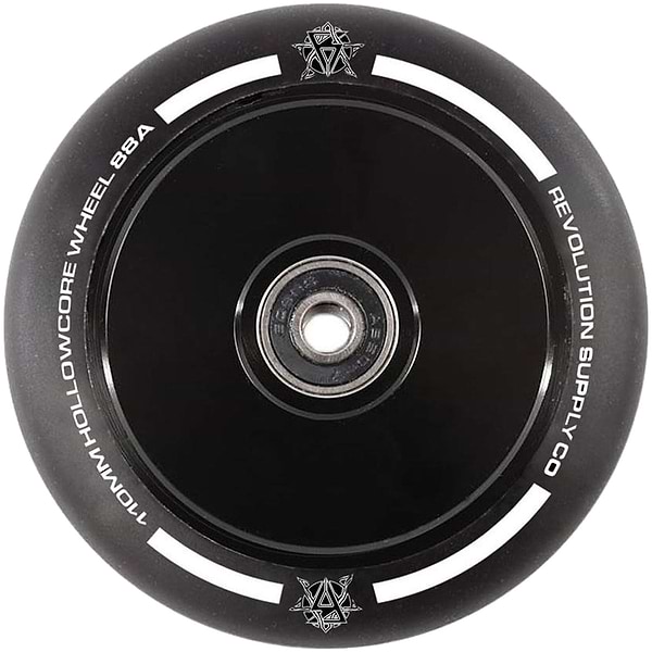 Close-up of the Revolution Hollowcore 110mm Stunt Scooter Wheel in black, featuring white text "110MM HOLLOWCORE WHEEL 88A" and "REVOLUTION SUPPLY CO." around the edge. This wheel, crafted by Revolution, showcases a minimalist design with a central hub and subtle decorative logos, making it ideal for premium scooter wheels.