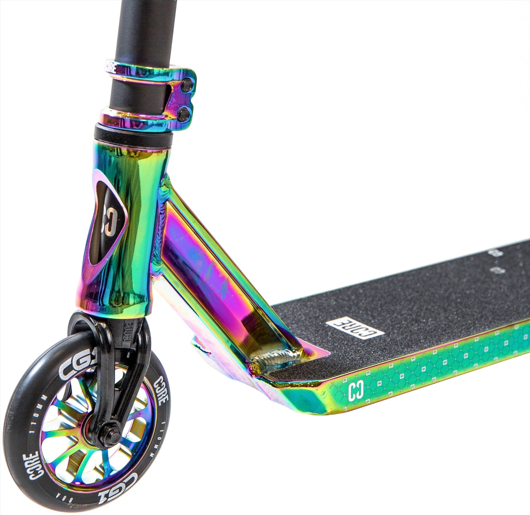 Close-up of the CORE CG1 Mini Complete Stunt Scooter in Neochrome/Black, featuring a black grip deck, black and white wheels, and a metallic neochrome finish. The branding "CORE" is visible on this vibrant beginner stunt scooter.