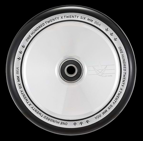 A close-up of the Blunt Envy 120mm Hollow Core Stunt Scooter Wheel in Silver Chrome highlights its metallic silver core and black tire, designed for maximum performance. The rim is adorned with the inscription "One Hundred Twenty x Twenty Six mm 86A" and features a bird logo along with "Hollow Core," showcasing Blunt Envy's advanced Hollowcore Wheels technology.