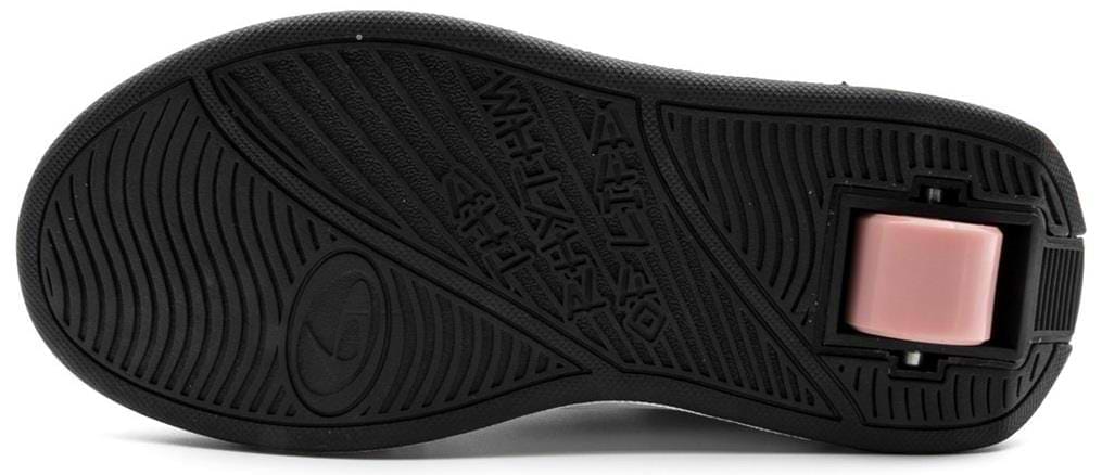 The image shows the black rubber sole of Breezy Rollers Star Shoes - Silver / Grey, featuring a pink retractable wheel near the heel and Breezy Rollers’ patented wheel system. Textured patterns provide grip for these popular wheeled shoes.