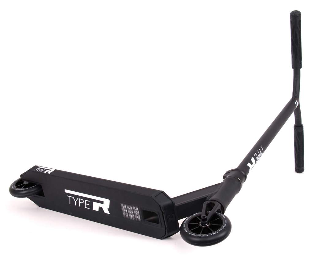 The Root Industries Type R Complete Stunt Scooter - Black is designed for performing tricks, featuring a T-bar handle and small wheels. Its deck showcases a sleek, matte finish along with the Root Industries design that enhances its stylish appeal.