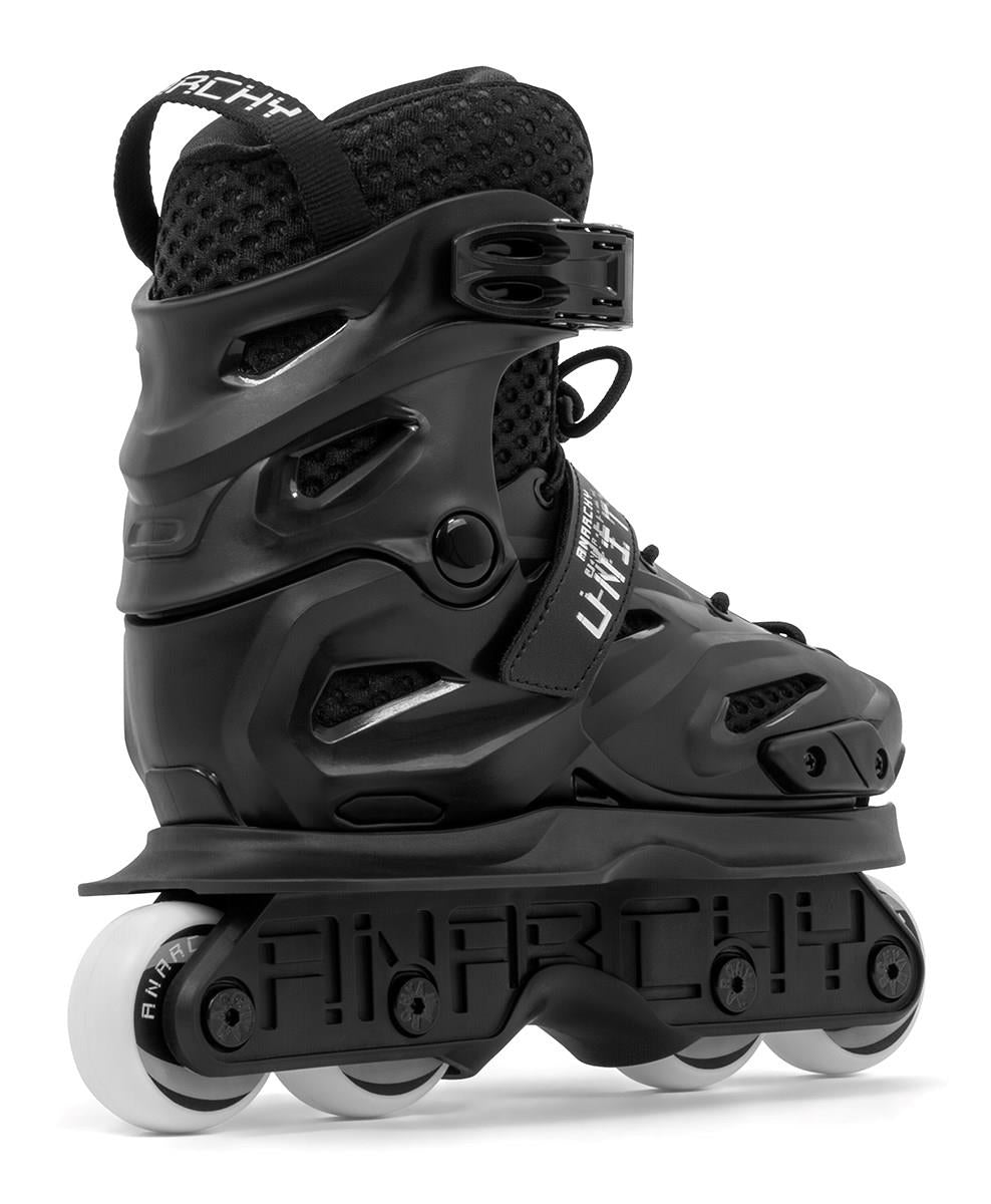 The Anarchy Unity Adjustable Aggressive Inline Skates in black feature a thick protective boot, sturdy ankle support, and four high-rebound PU wheels for tricks and stunts. "ANARCHY" is printed on the frame.