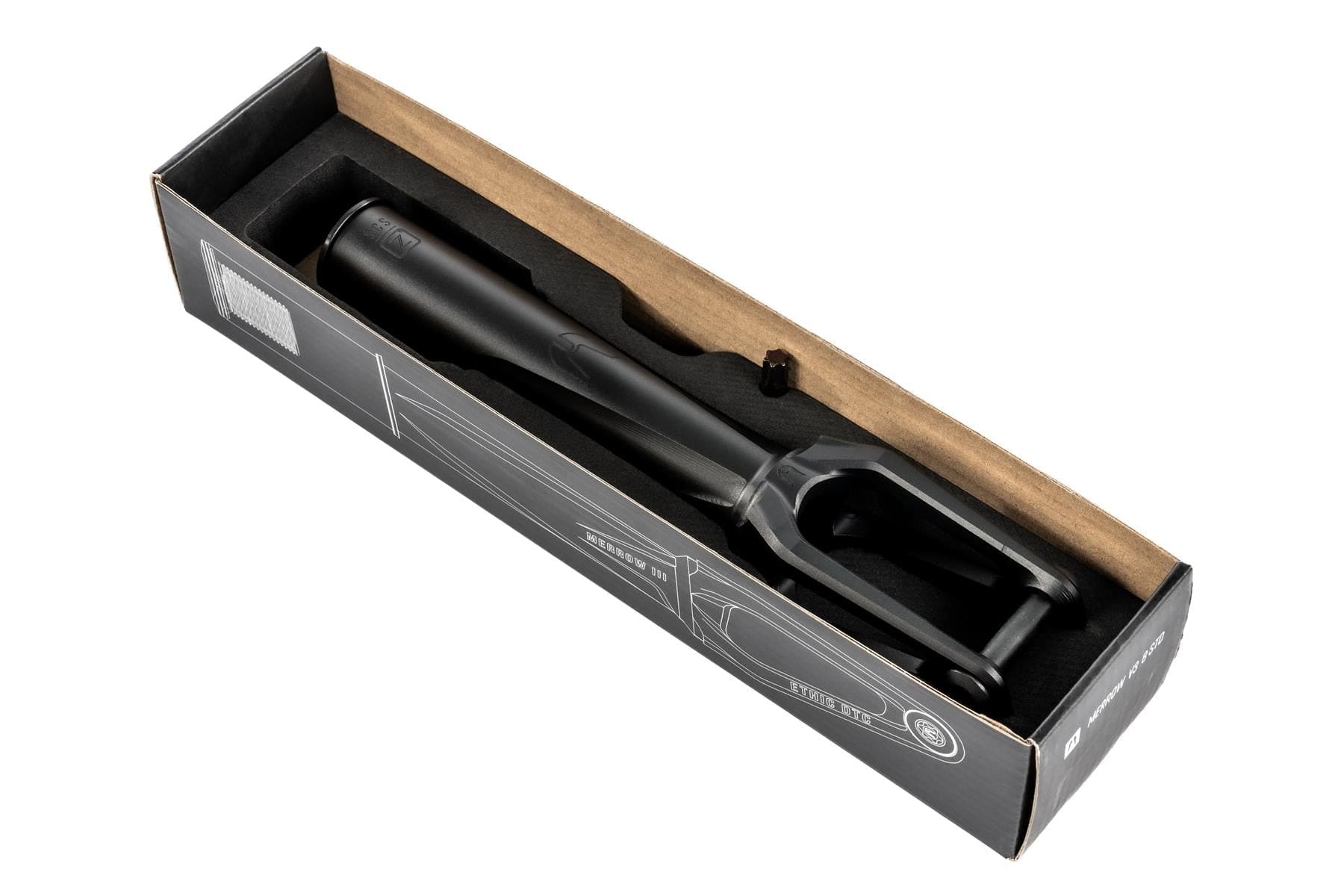 The Ethic DTC Merrow V3 SCS Stunt Scooter Fork in black, crafted from 7075 aluminium and among the lightest forks, is seen from above in a partially open cardboard box with black and white printed graphics.