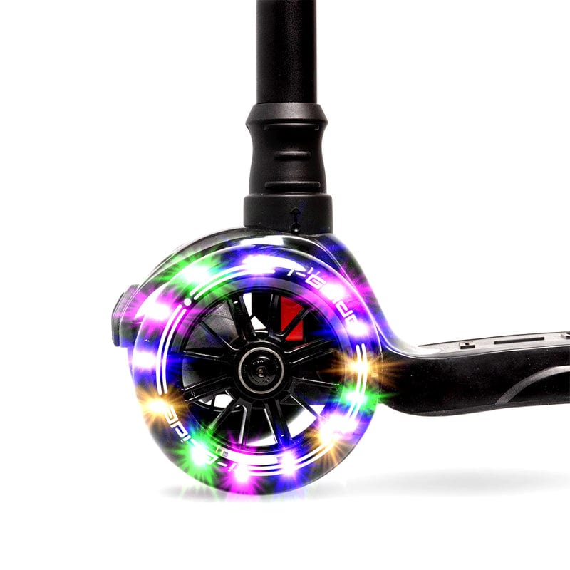 The i-Glide 3-Wheel LED Kids Scooter - Black features a close-up of its scooter wheel with vibrant multicolored LED lights, including shades of red, green, blue, and purple arranged in a swirling circular pattern. The black frame and adjustable height handlebar ensure an ideal fit for young riders.