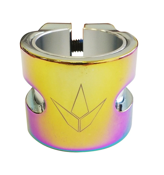 Introducing the Blunt Envy Twin Slit 2 Bolt Oversized Scooter Clamp in Oil Slick Neochrome. This lightweight aluminium clamp boasts a unique iridescent finish that shimmers in shades of gold, purple, and green. It features a sleek cylindrical design with two bolt holes and a central opening, perfect for securing to a stunt scooter bar. The crown-like logo is meticulously engraved, adding an elegant touch to its vibrant appearance.
