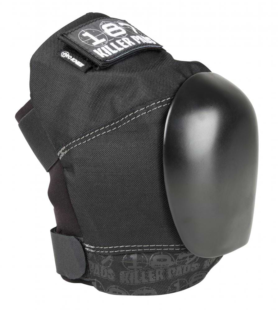 The 187 Killer Pro Knee Skate Protection Pads in black, designed by 187, feature a hard plastic cap and adjustable straps for action sports. With stitched detailing and text reading "Killer Pads" on the front, these pads deliver strong protection against heavy impacts.