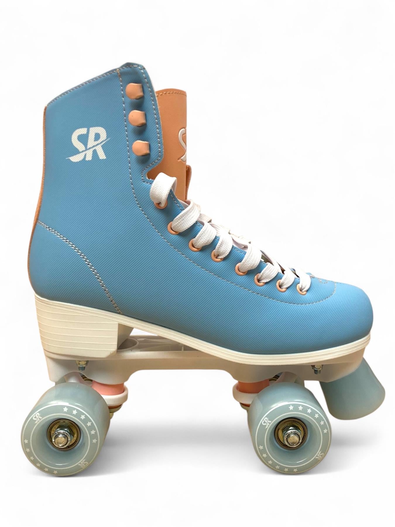 The Supreme Malibu Quad Roller Skates - Light Blue by Supreme feature a retro design with white laces, tan accents, and four light blue wheels. "SR" is printed near the ankle. Displayed in profile on a white background, ideal for recreational skating.