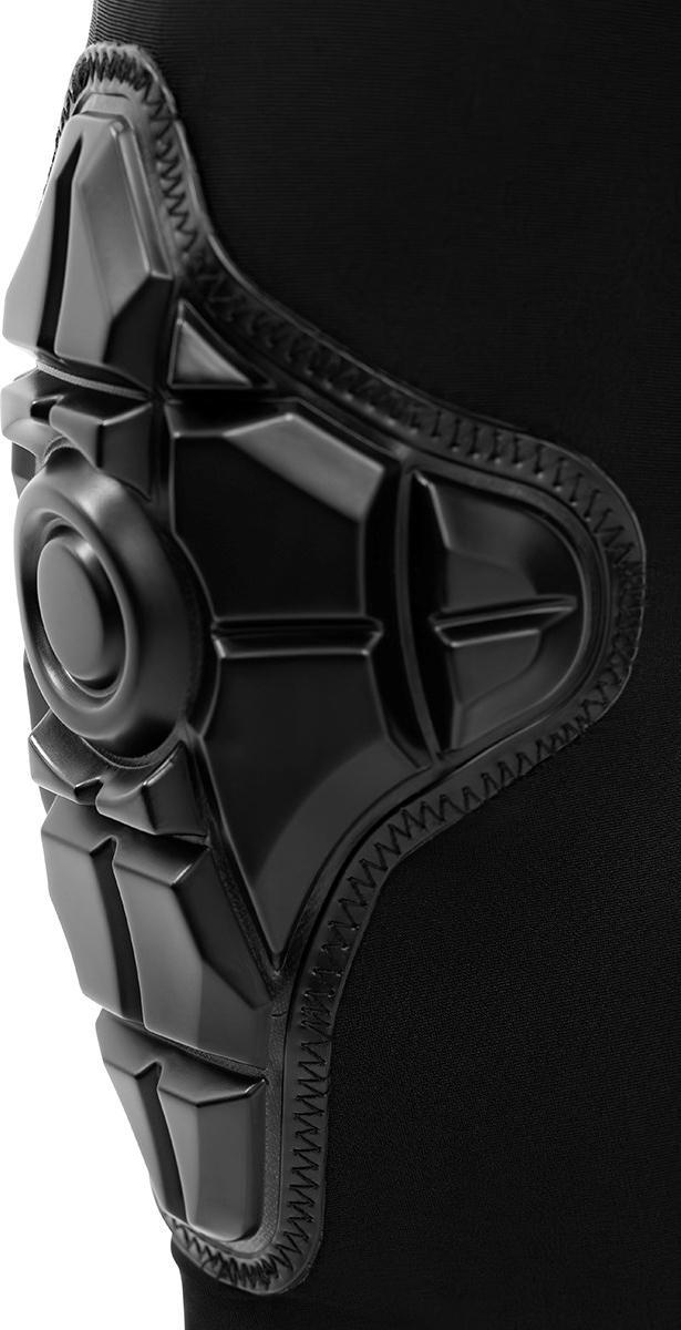 Close-up of REKD Energy Knee Skate Protection Gaskets in black, featuring geometric Energy Foam padding and zigzag stitching, worn on a leg against a black background.