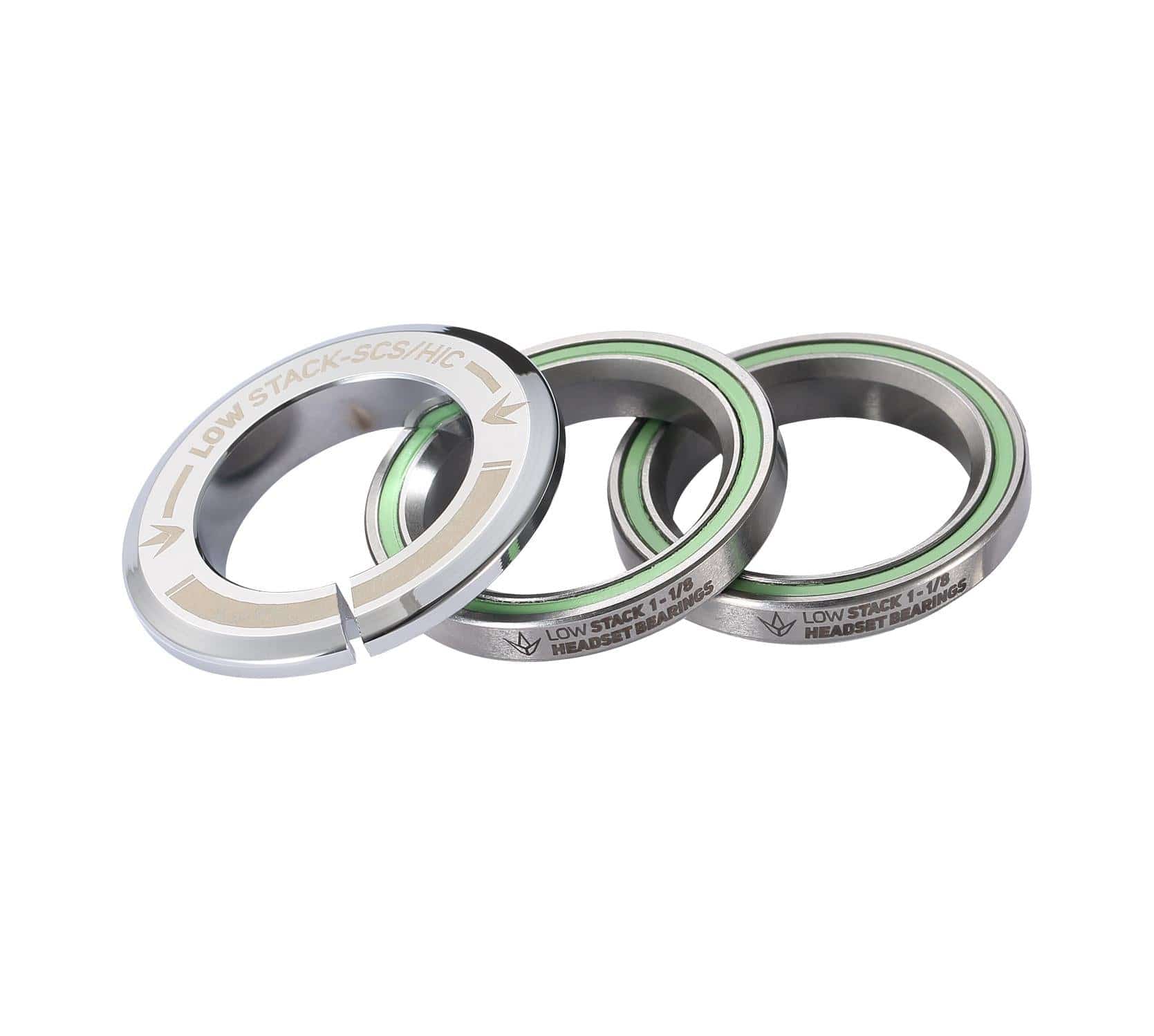 The Blunt Envy Low Stack SCS Integrated Stunt Scooter Headset in Chrome features a set of three bearings with a minimalist design and engraved text. Each round piece showcases a smooth finish paired with green inner rings. The top component includes unique cutout notches, and all pieces come equipped with fully sealed bearings to ensure enhanced durability.