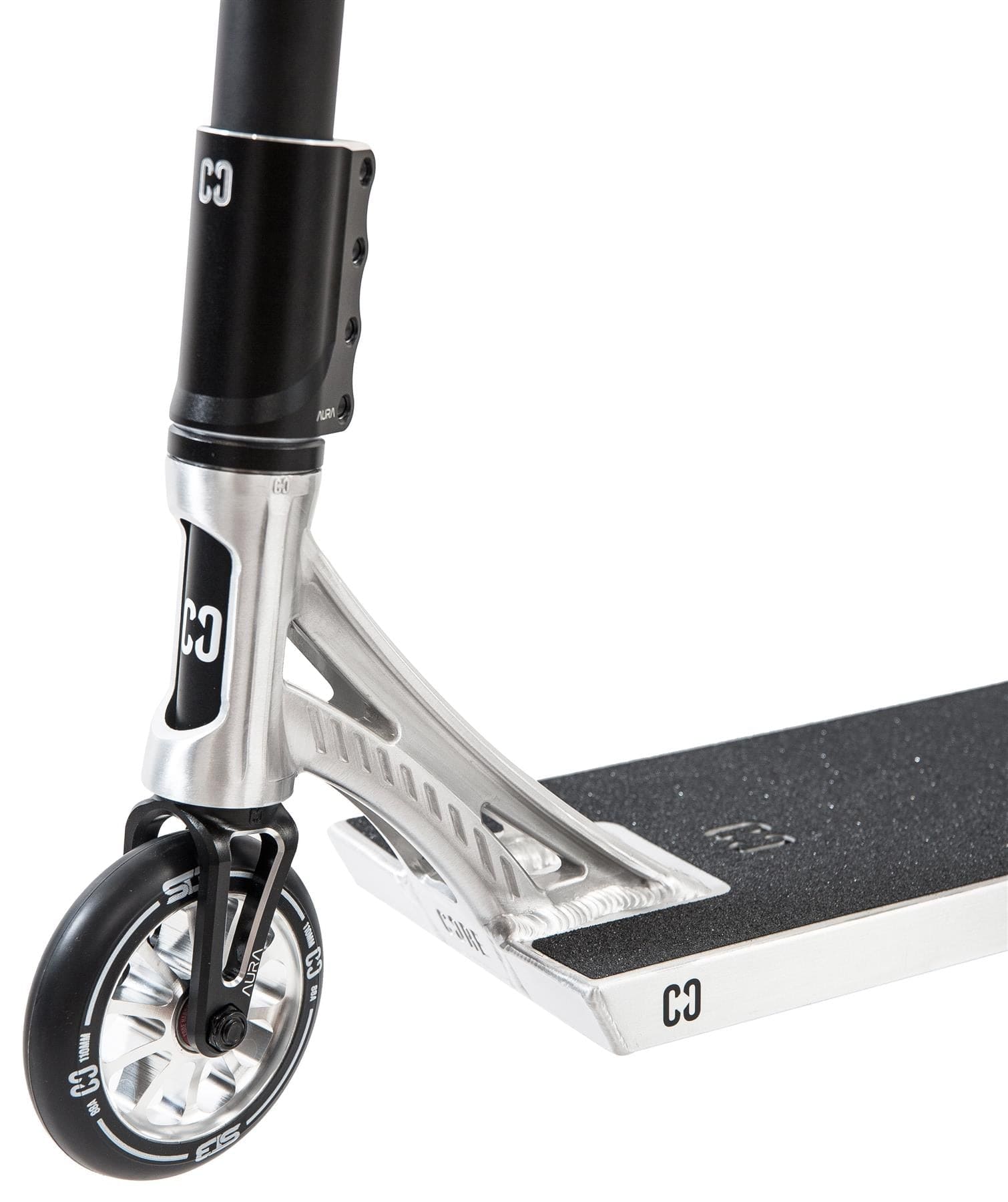 Close-up of the CORE ST3 Complete Stunt Scooter - Polished, showing its black handlebar, silver fork, black and silver wheel, and textured black deck with a white "CO" logo, all constructed from pro-grade components by CORE.