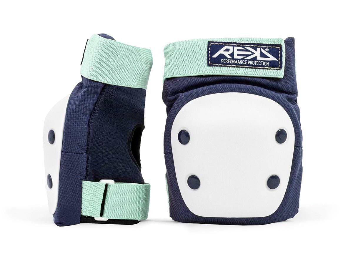The REKD Heavy Duty Triple Skate Protection Pad Set in blue and mint features two protective knee pads with dark blue coloring, equipped with white hard caps and mint green straps for optimal knee protection. The "REKD" brand logo is prominently displayed on the top, while the pads are shown upright against a white background to highlight their strong design and functionality.
