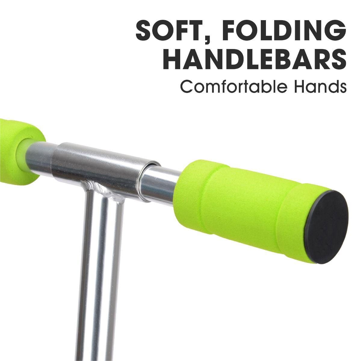 Close-up of the Xootz Atom Foldable Kids Kick Scooter's soft, folding handlebars with green grips. Text reads "SOFT, FOLDING HANDLEBARS Comfortable Hands" at the top. The scooter has adjustable handlebars on a lightweight metal frame.