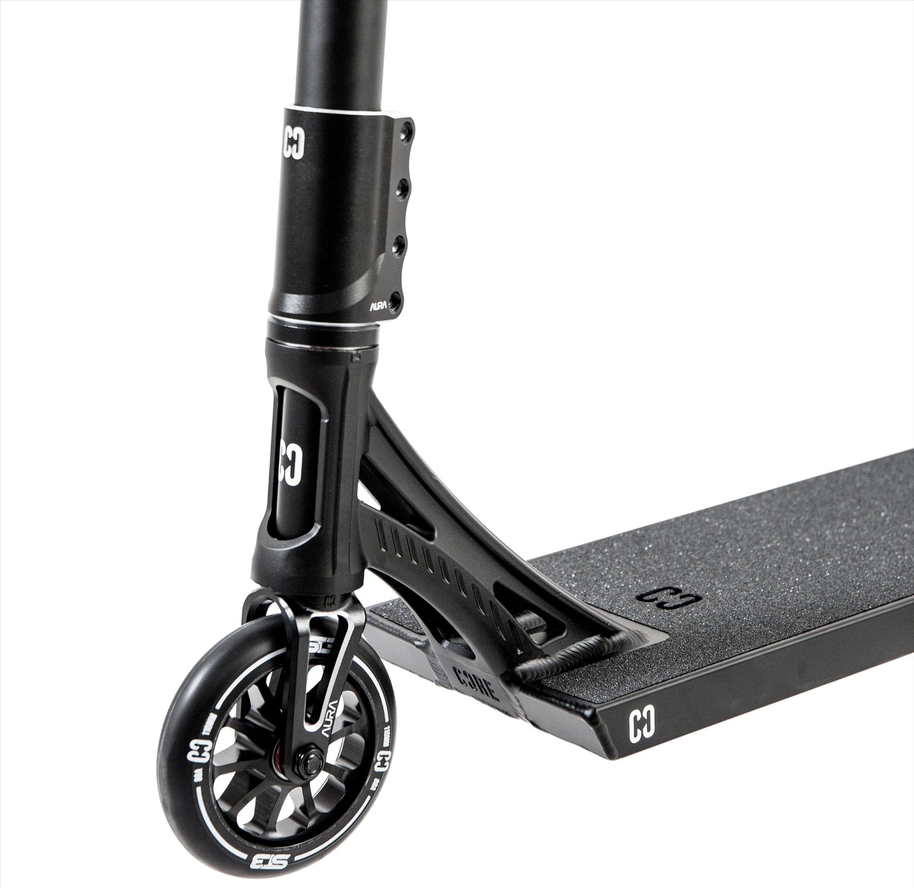 Close-up of the CORE ST3 Complete Stunt Scooter in black, showing pro-grade front wheel, fork, handlebars, and a grippy deck with distinctive white "CORE" branding on the wheel and deck.